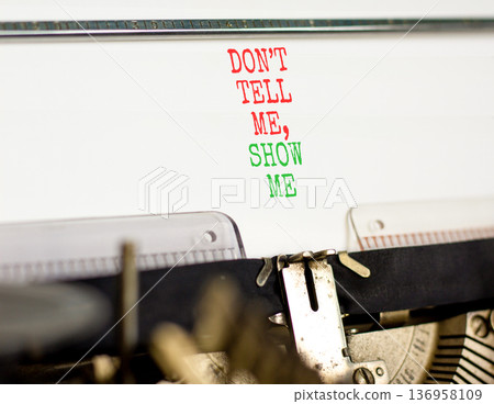 Tell or show symbol. Concept words Do not tell me, show me typed on old retro typewriter. Beautiful white background. Business tell or show concept. Copy space. Tell or show symbol. Concept words Do not tell me, show me typed on old retro typewriter. Beautiful white background. Business tell or show concept. Copy space. 136958109