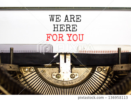 Support, help and we are here for you symbol. Concept words We are here for you typed on beautiful old retro typewriter. Beautiful white background. Business we are here for you concept. Copy space. 136958113