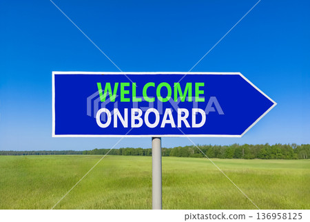 Welcome onboard symbol. Concept words Welcome onboard on beautiful blue road sign. Beautiful blue sky green grass field background. Business, motivational welcome onboard concept. Copy space. Welcome onboard symbol. Concept words Welcome onboard on beautiful blue road sign. Beautiful blue sky green grass field background. Business, motivational welcome onboard concept. Copy space. 136958125