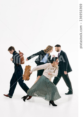 Business team crossing paths in expressive walking poses on white background. 136958369