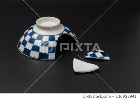 Broken rice bowl, Japanese tableware with a checkered pattern and a black background 136958941