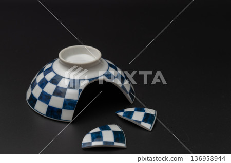 Broken rice bowl, Japanese tableware with a checkered pattern and a black background 136958944