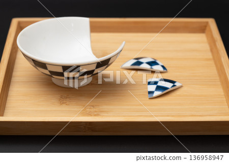 Broken rice bowl, Japanese tableware with a checkered pattern and a black background 136958947