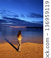 Woman relaxing on a beautiful beach 136959119