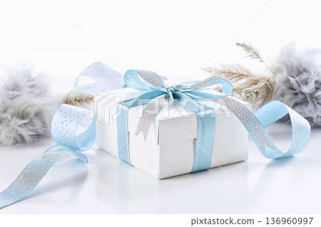 A white gift box and bouquet decorated with light blue and silver ribbons 136960997
