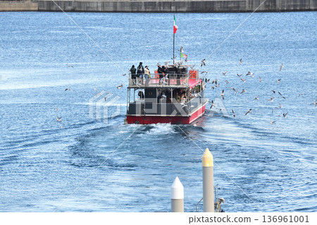 A red sightseeing boat flocked with divine eyes A red sightseeing boat flocked with divine eyes 136961001