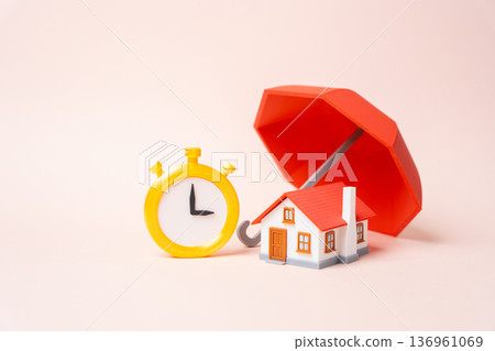 A house under a red insurance umbrella and a stopwatch. Timeframes for home insurance and protection. Policy duration and renewal deadlines. Property risk coverage and contract term management 136961069
