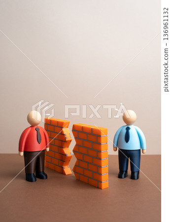 Breaking down the wall of misunderstanding between the parties and a chance to resolve the conflict. Reconciliation and open dialogue. Conflict resolution and partnership recovery concept. 136961132