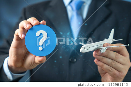 A passenger aircraft and a question mark. FAQ on flights and airport check in preparation. Travel guidance and airline information support. Passenger awareness and trip planning 136961143