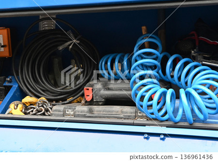 Tools and equipment in storage compartment 136961436