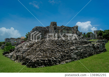 Mayan stone pyramid ruins with stepped platform in tulum mexico Mayan stone pyramid ruins with stepped platform in tulum mexico 136962291