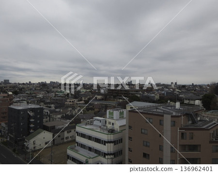 Looking out at the surroundings from the rooftop of the apartment building. 136962401