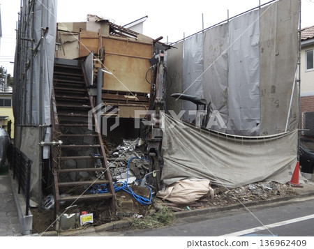 Wooden house and heavy machinery under demolition Wooden house and heavy machinery under demolition 136962409