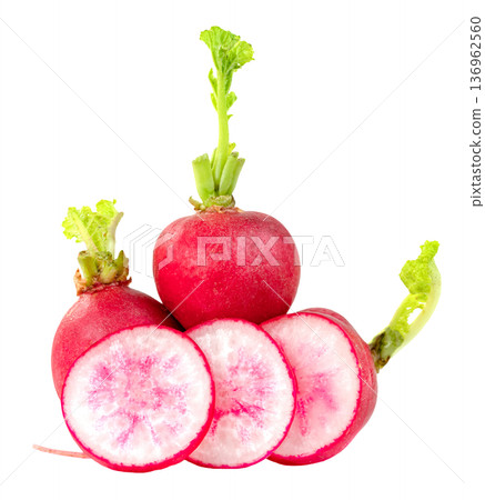 Fresh red radishes with green sprouts and round slices isolated. Crisp organic garden vegetables for healthy cooking and salad. Professional studio shot of raw vibrant roots. 136962560