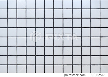 White ceramic tile background. Old vintage ceramic tiles in white to decorate the kitchen or bathroom White ceramic tile background. Old vintage ceramic tiles in white to decorate the kitchen or bathroom 136962566