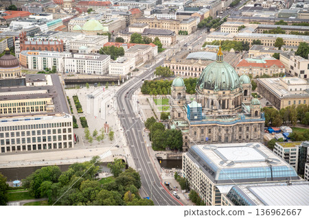 Berlin, germany, august 15, 2023. Berlin cityscape with berlin cathedral, museum island, and spree river under cloudy sky, showcasing historical and modern architecture Berlin, germany, august 15, 2023. Berlin cityscape with berlin cathedral, museum island, and spree river under cloudy sky, showcasing historical and modern architecture 136962667