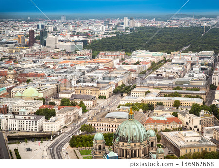 Berlin, germany, august 15, 2023. Berlin cityscape with the historic berliner dom dome, surrounding buildings, and tiergarten green areas under a blue sky Berlin, germany, august 15, 2023. Berlin cityscape with the historic berliner dom dome, surrounding buildings, and tiergarten green areas under a blue sky 136962668