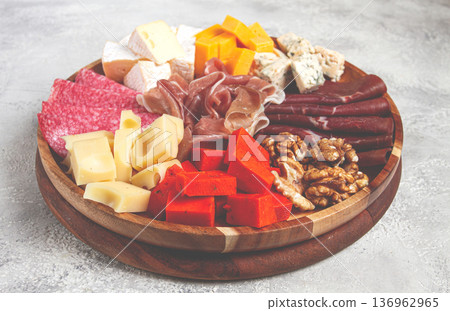 assortment of cheese meat cuts, on a plate, top view, no people, 136962965
