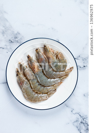 Fresh raw white-footed shrimp, tiger prawns vannamei, on a white plate, Fresh raw white-footed shrimp, tiger prawns vannamei, on a white plate, 136962975