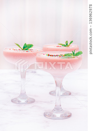 fruit mousse, made from jelly and cottage cheese, in glasses, decorated with sprinkles and mint, homemade 136962978