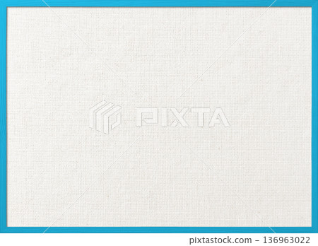 White cotton and linen canvas board with a thin light blue wooden frame background image 136963022