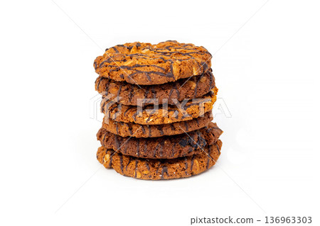 Freshly Baked Chocolate Chip Cookies Stacked on Top of Each Other With a Simple White Background Freshly Baked Chocolate Chip Cookies Stacked on Top of Each Other With a Simple White Background 136963303