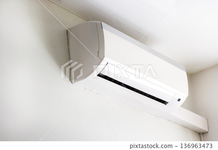 Split System Air Conditioner Mounted at Wall in Living Room Home Split System Air Conditioner Mounted at Wall in Living Room Home 136963473