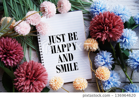 Just Be Happy and Smile Motivational and Inspirational quotes on wooen background 136964620