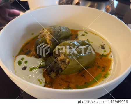 Stuffed green bell peppers with rice and sauce Stuffed green bell peppers with rice and sauce 136964638