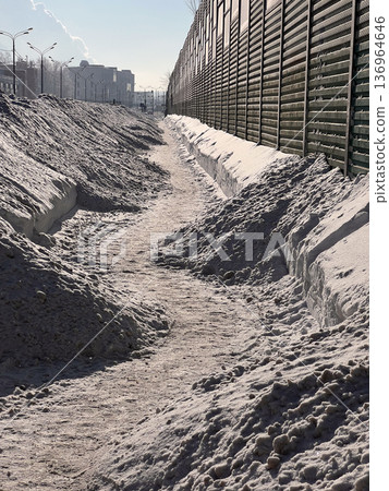 Narrow pathway through deep snow in city Narrow pathway through deep snow in city 136964646