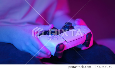Gamer Kid Hands Playing Video Game On Console With Joystick.schoolboy Having Fun Gamer Kid Hands Playing Video Game On Console With Joystick.schoolboy Having Fun 136964930