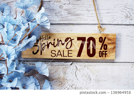 Spring Sale 70% off with flower bouquet decoration on wooden background Spring Sale 70% off with flower bouquet decoration on wooden background 136964958