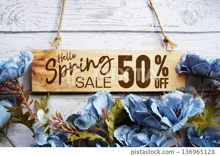 Spring Sale 50% off with flower bouquet decoration on wooden background 136965128