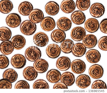 Delicious chocolate cupcakes topped with swirled frosting and chocolate shavings, isolated on white background, concept of dessert 136965545