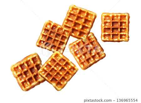 Multiple golden brown square waffles scattered randomly, isolated on white background. Concept of breakfast or snack food 136965554