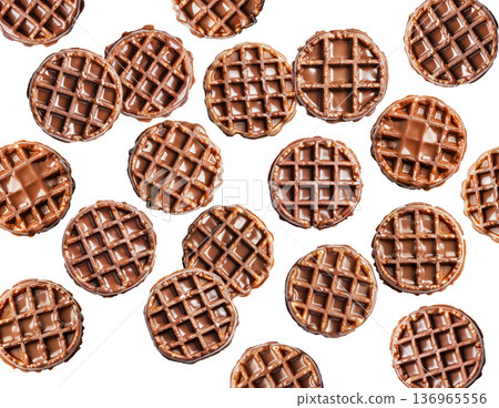 Multiple chocolate covered waffles arranged in a flat lay style isolated on white background, showing a sweet dessert food concept 136965556