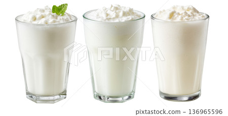Ayran salted yogurt drink in tall glass with foamy top and mint leaf, isolated on white background, concept of healthy drink 136965596