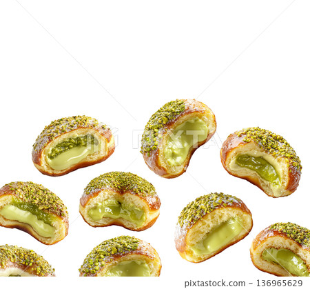 Multiple pistachio glazed donuts with crushed nuts isolated on a white background, concept of sweet bakery treats 136965629