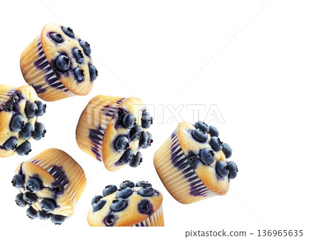 Multiple fresh blueberry muffins in scattered arrangement, isolated on white background. Concept of tasty homemade baking 136965635