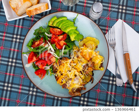 French style meat with fried potatoes and vegetable salad French style meat with fried potatoes and vegetable salad 136966461