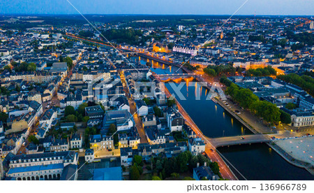 Evening aerial view of Laval with buildings, river Mayenne and old bridge Evening aerial view of Laval with buildings, river Mayenne and old bridge 136966789