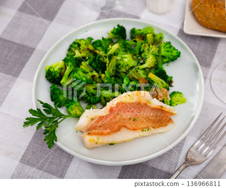 Appetizing fillet of gallineta with broccoli Appetizing fillet of gallineta with broccoli 136966811