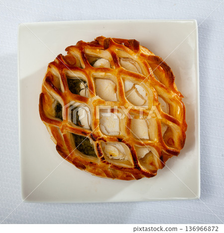 Pastry stuffed with goat cheese and spinach Pastry stuffed with goat cheese and spinach 136966872