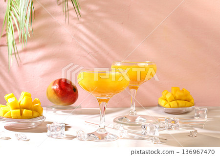 Frozen mojito with tequila, lemon, and ice, lemonade, or juice with mango slices, bar and party concept, restaurant and cafe advertising card, restaurant menu, house party advertising banner 136967470