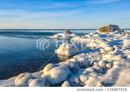 Winter Seascape with Icy Fortification Ruins on Baltic Sea Coast in Liepaja Latvia 136967828