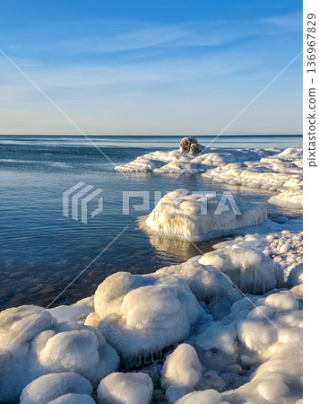 Winter Seascape with thick ice formations on the Baltic Sea Coast in Liepaja, Latvia 136967829