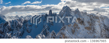 Beautiful Winter Mountain Scenery with Man on Cross-Country Skis Beautiful Winter Mountain Scenery with Man on Cross-Country Skis 136967985