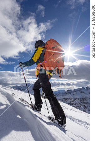 Beautiful Winter Mountain Scenery with Man on Cross-Country Skis Beautiful Winter Mountain Scenery with Man on Cross-Country Skis 136968000