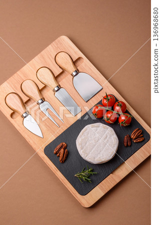 White French cream cheese Brie or Camembert for breakfast. Brie or Camembert cheese 136968680