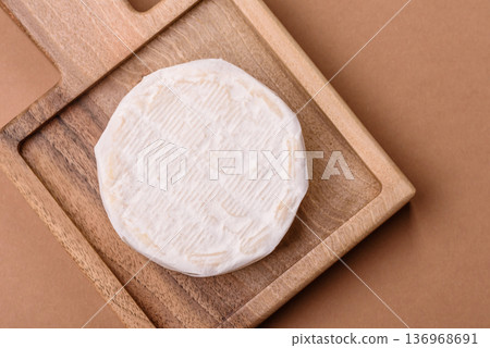 White French cream cheese Brie or Camembert for breakfast. Brie or Camembert cheese White French cream cheese Brie or Camembert for breakfast. Brie or Camembert cheese 136968691